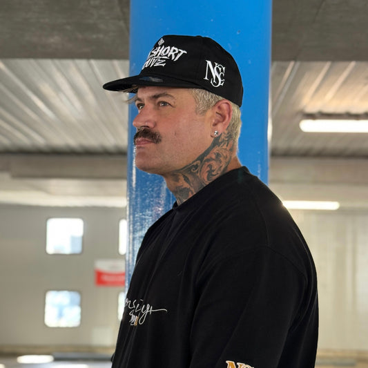The “BRAND” cap